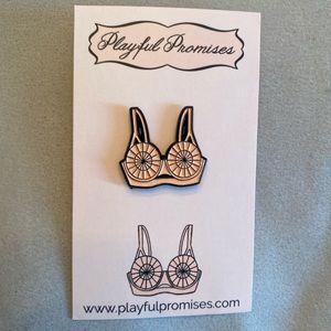 Playful Promises bullet bra enamel pin